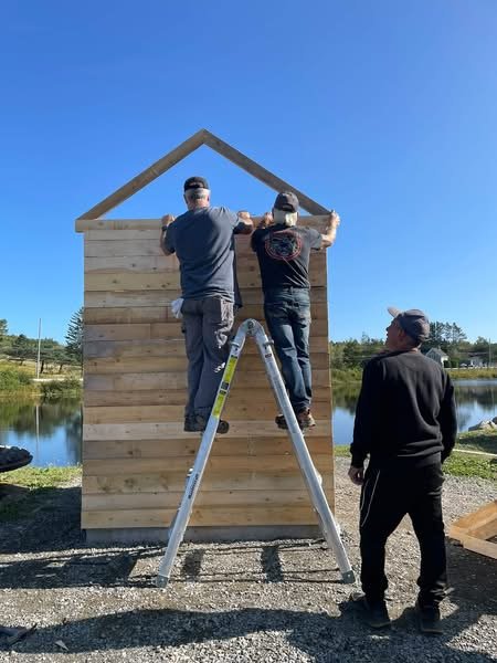 Bangor Museum Committee volunteers raising the roof frame